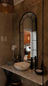 a bathroom with a sink and a large mirror at Casa Ceauș in Baia-Sprie +189 photos