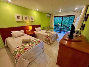 En eller flere senge i et værelse på Flat de Luxo no Costabella Marina Resort Angra + 55 billeder