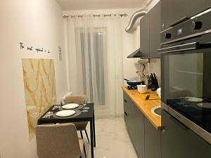 Køkken eller tekøkken på 1Bedroom Sofa 1child Full Kitchen Free Parking + 13 billeder