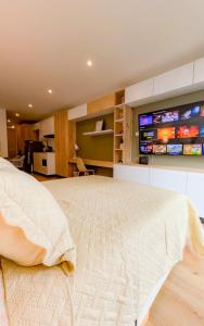 En eller flere senge i et værelse på Loft Vista Panorámica Bogotá