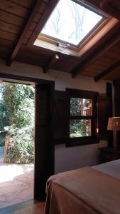 Postel nebo postele na pokoji v ubytování Pousada Regina Guest House - Chalé 1