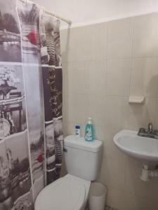 Et badeværelse på Jardines del Mar by La Cultura Suites - Boutique Studios Playa del Carmen