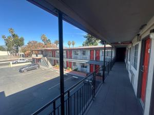 an empty hallway of a school building with a parking lot at Heritage Inn in Pomona