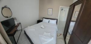 Postel nebo postele na pokoji v ubytování GF AXD Apartment