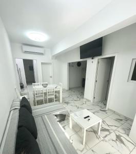 a living room with a couch and a table at VV Abrante in La Restinga