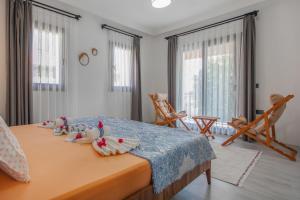 En eller flere senge i et værelse på Villa Rengin Datça Stone House