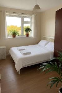 Ένα ή περισσότερα κρεβάτια σε δωμάτιο στο Bright & Cozy 1-Bedroom Flat in a Quiet Sutton