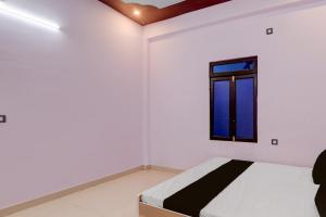 Una cama o camas en una habitación de Hotel O N P Grand and Resort