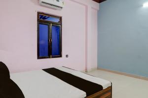 Una cama o camas en una habitación de Hotel O N P Grand and Resort