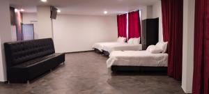 Postel nebo postele na pokoji v ubytování Hotel Paradise