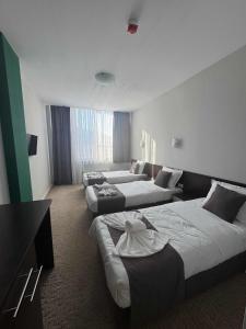 En eller flere senge i et værelse på Мотел КОМПЛЕКС GRILL and CHILL