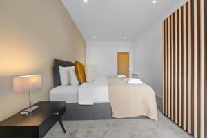 Postel nebo postele na pokoji v ubytování Beachwalk Apartments by Nova Suites