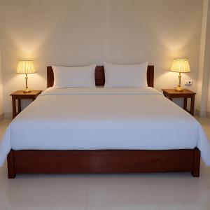 Giường trong phòng chung tại Sipanya Guesthouse