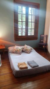 En eller flere senge i et værelse på Casa Pugliese