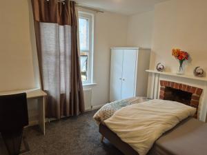 Ένα ή περισσότερα κρεβάτια σε δωμάτιο στο CityLink House