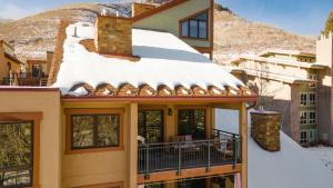 a house with snow on the roof at Cloud 9 by AvantStay Located at the Base of Vail Ski Resort w Community Pool Hot Tub in Vail