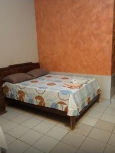 Una cama o camas en una habitación de Hostal FINI