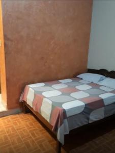 Una cama o camas en una habitación de Hostal FINI