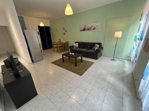 a living room with a couch and a table at Il nido di Fra&Gab in Genova