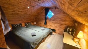 an overhead view of a bedroom in a log cabin at Cozy River Cabin Styled Loft in Kiruna