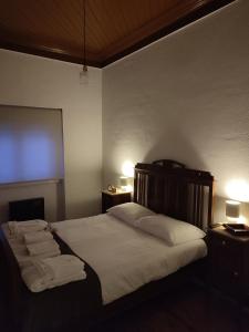 a bedroom with a bed with towels on it at Quinta das Maçãs by SH in Alvaiázere