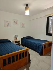 Ένα ή περισσότερα κρεβάτια σε δωμάτιο στο Hermosa vista a la montaña