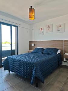 Ένα ή περισσότερα κρεβάτια σε δωμάτιο στο Hermosa vista a la montaña