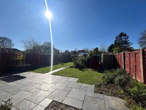 a street light in a yard with a fence at The Garden view Nook in Ash