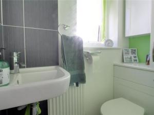 a bathroom with a sink and a toilet at The Garden view Nook in Ash
