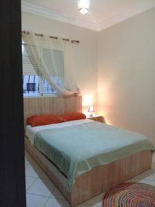 Ένα ή περισσότερα κρεβάτια σε δωμάτιο στο Appartement Spacieux et Lumineux à Tilila