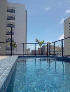 a swimming pool on the roof of a building at Flat Beach Way caminho da praia in Cabedelo