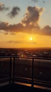 a view of the sunset from the top of a building at Flat Beach Way caminho da praia in Cabedelo