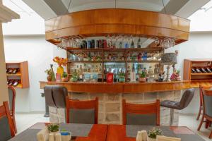 a bar in a restaurant with a table and chairs at Casona Plaza Hotel Arequipa in Arequipa