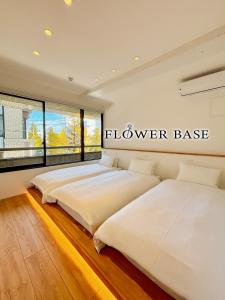 Postel nebo postele na pokoji v ubytování Flower Base HIMAWARI