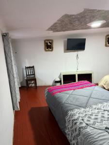 Кровать или кровати в номере QOLLA WASI - Santa Ana