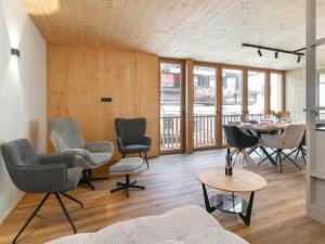 a living room with chairs and a table at Hopfgarten Alpin Living Top 3 in Hopfgarten im Brixental