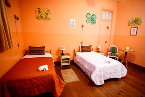 Cama ou camas em um quarto em Lima Wari Hotel Boutique