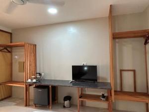 a room with a desk with a computer on it at El Nido, Corong Corong Pier in El Nido