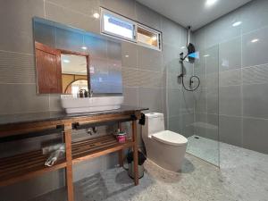 a bathroom with a sink and a toilet and a mirror at El Nido, Corong Corong Pier in El Nido +17 photos