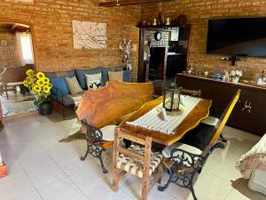 a living room with a couch and a table at One Cabañas 2 in Los Antiguos