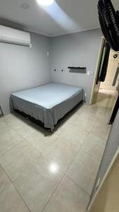 Ένα ή περισσότερα κρεβάτια σε δωμάτιο στο Refúgio dos Anjos