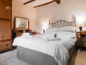 Giường trong phòng chung tại The Old Barn