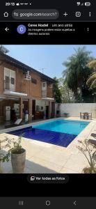 een foto van een zwembad voor een huis bij Áurea da Mata in Cuiabá