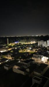 a view of a city at night with lights at Apartamento campinas lado Puc 2 in Campinas +14 photos