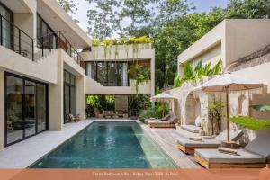 an exterior view of a house with a swimming pool at Bebas Villas - Uluwatu, Bali in Uluwatu