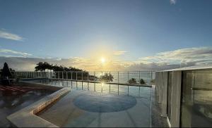 a view of the ocean from the balcony of a house at Estúdio a 1 min do mar - Mila rooftop in Tamandaré