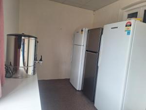 a kitchen with two refrigerators and a blender at Adelaide Free Souls in Adelaide