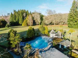 an aerial view of a house with a swimming pool at Wairakei Resort Taupo in Taupo