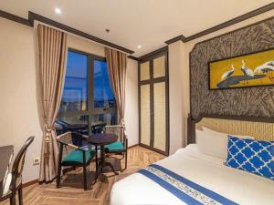 Кровать или кровати в номере Brics Boutique Dalat +78 фотографий