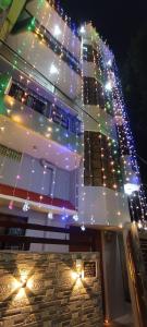 a building with christmas lights on the side of it at Bajrang kutir 17 in Varanasi